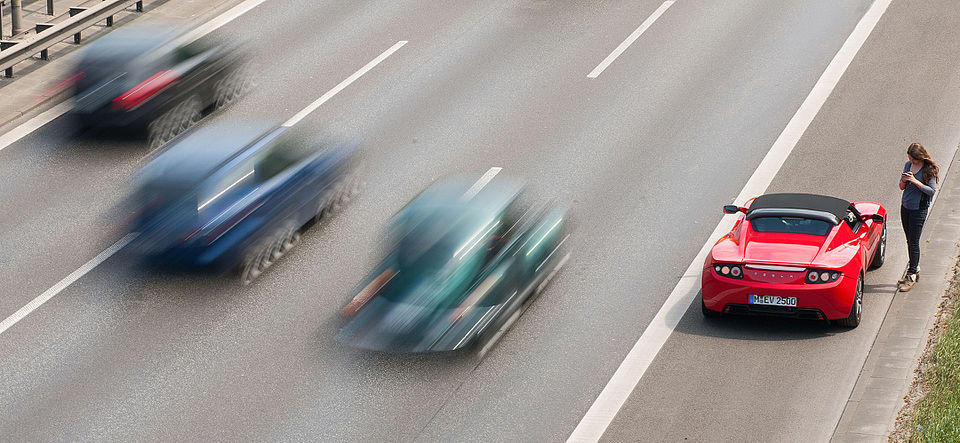 Car on emergency lane on motorway